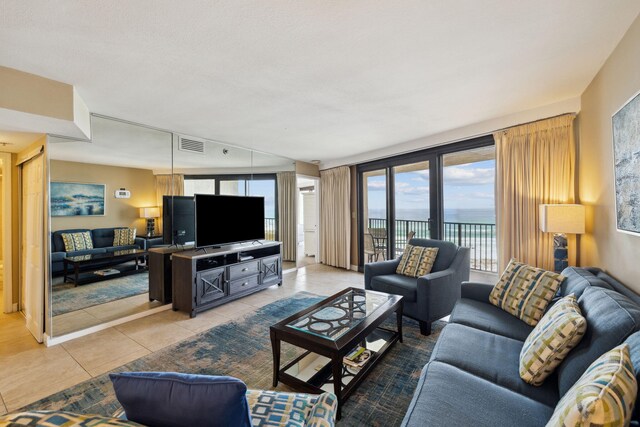 living area featuring light tile patterned floors