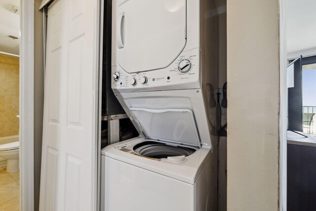 washroom with stacked washer and clothes dryer
