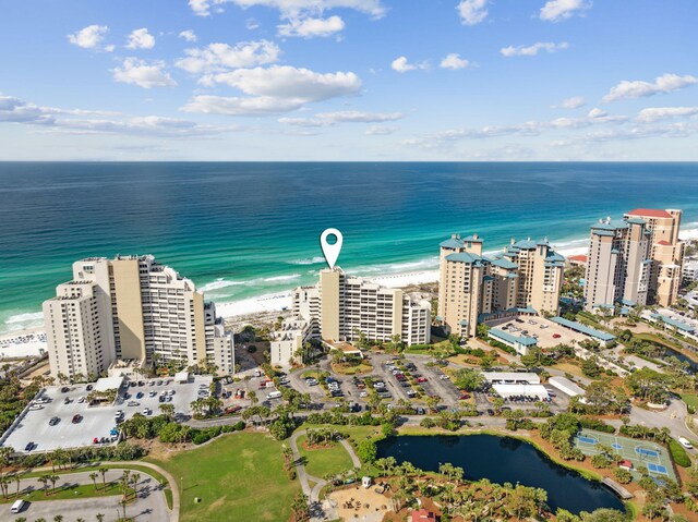 drone / aerial view of a nearby body of water and apartment complex