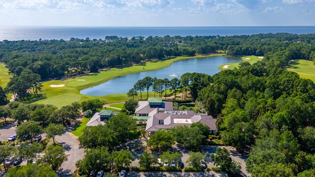 drone / aerial view of a local golf course and a large body of water