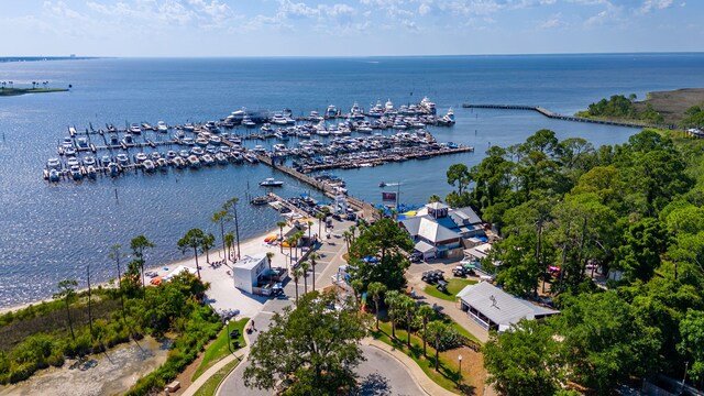 bird's eye view of a nearby body of water and numerous boat docks
