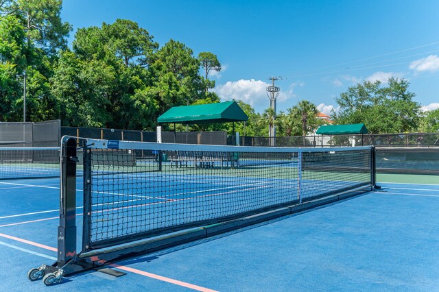 view of tennis court with fence