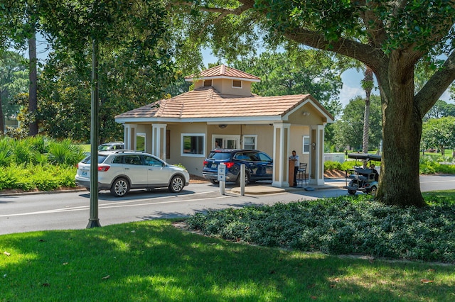 view of home's community featuring a lawn