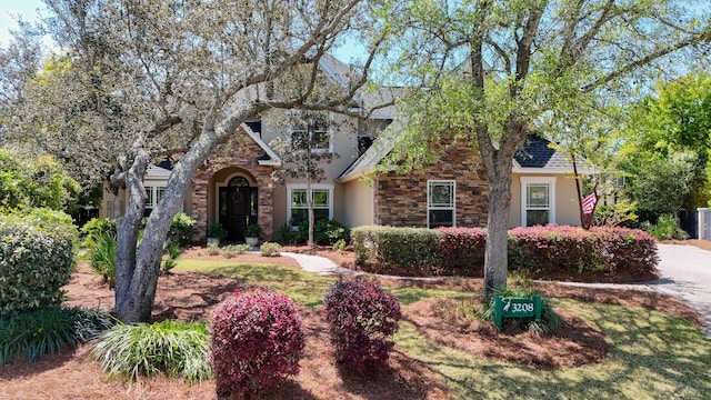 3208 Magnolia Islands Blvd, Panama City Beach, FL 32408 - view of front of home featuring stone siding and stucco siding