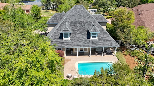 3208 Magnolia Islands Blvd, Panama City Beach, FL 32408 - rear view of property featuring a patio area, stucco siding, an outdoor pool, and a shingled roof