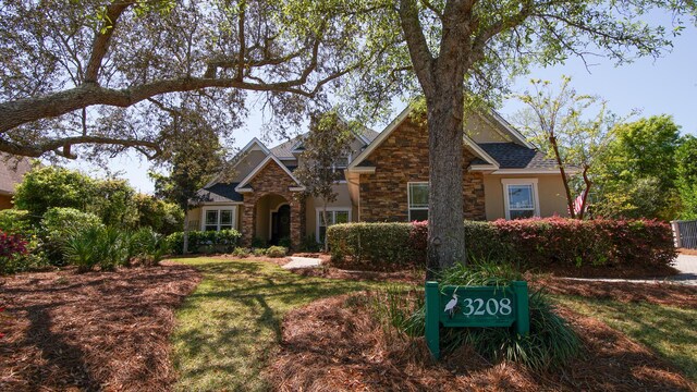 3208 Magnolia Islands Blvd, Panama City Beach, FL 32408 - view of front facade with stone siding and stucco siding