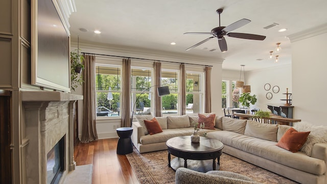 3208 Magnolia Islands Blvd, Panama City Beach, FL 32408 - living area featuring ornamental molding, a high end fireplace, ceiling fan, dark wood-style floors, and recessed lighting