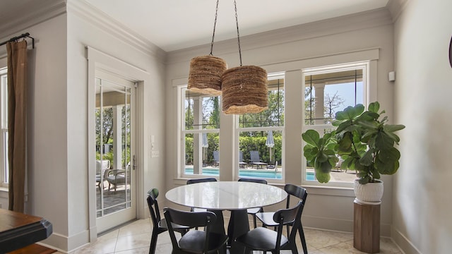 3208 Magnolia Islands Blvd, Panama City Beach, FL 32408 - dining room with plenty of natural light, light tile patterned floors, baseboards, and crown molding