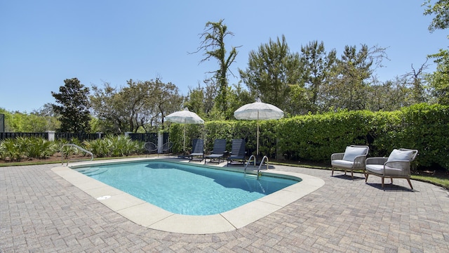 3208 Magnolia Islands Blvd, Panama City Beach, FL 32408 - view of swimming pool featuring a patio and a fenced backyard