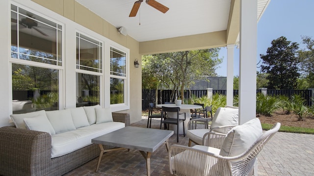 3208 Magnolia Islands Blvd, Panama City Beach, FL 32408 - fenced backyard featuring an outdoor living space, a ceiling fan, and a patio