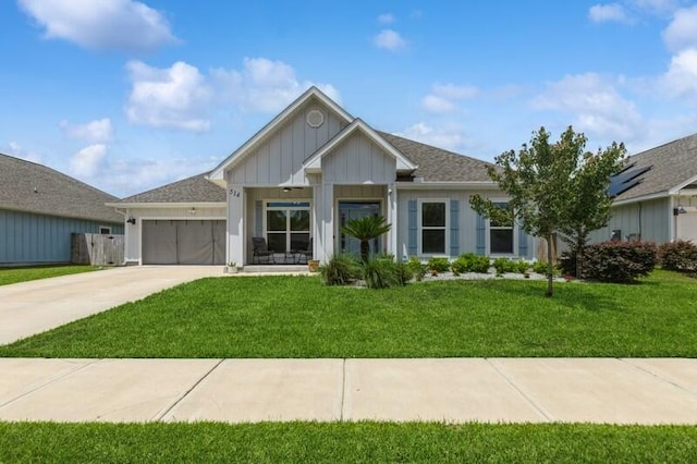 514 Mary Lou Way, Crestview, FL 32539 - ranch-style home featuring board and batten siding, an attached garage, a front yard, and driveway