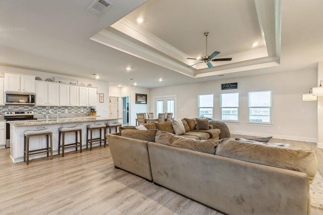 514 Mary Lou Way, Crestview, FL 32539 - living room featuring a raised ceiling, ceiling fan, ornamental molding, light wood-type flooring, and recessed lighting