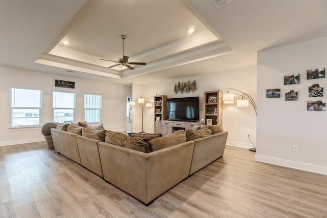 514 Mary Lou Way, Crestview, FL 32539 - living area with a tray ceiling, baseboards, light wood-style flooring, crown molding, and recessed lighting