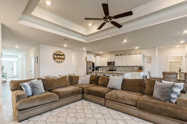 514 Mary Lou Way, Crestview, FL 32539 - living area with ceiling fan, a raised ceiling, recessed lighting, crown molding, and light wood finished floors