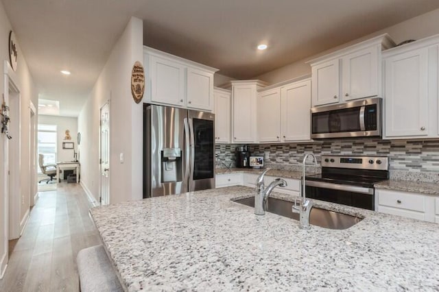 514 Mary Lou Way, Crestview, FL 32539 - kitchen with stainless steel appliances, a sink, tasteful backsplash, white cabinets, and recessed lighting