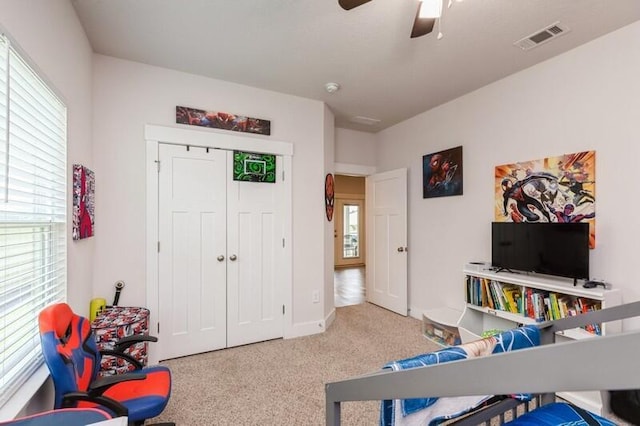 514 Mary Lou Way, Crestview, FL 32539 - carpeted bedroom featuring multiple windows, a closet, and a ceiling fan