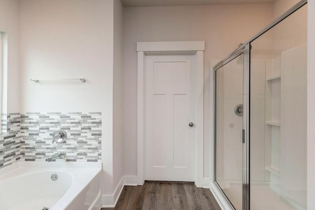 514 Mary Lou Way, Crestview, FL 32539 - bathroom with a shower stall, wood finished floors, and a garden tub