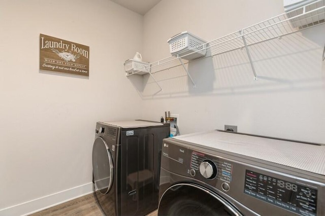 514 Mary Lou Way, Crestview, FL 32539 - washroom featuring baseboards, washing machine and dryer, and wood finished floors