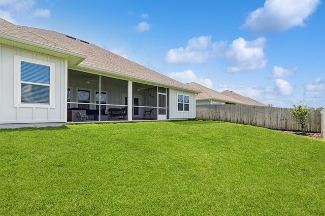 514 Mary Lou Way, Crestview, FL 32539 - back of property featuring board and batten siding, roof with shingles, and a sunroom