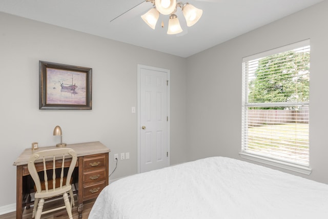 bedroom featuring wood finished floors and a ceiling fan
