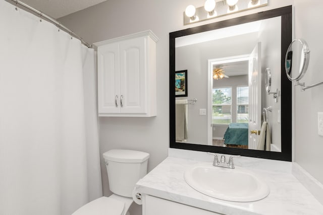 ensuite bathroom with vanity and toilet