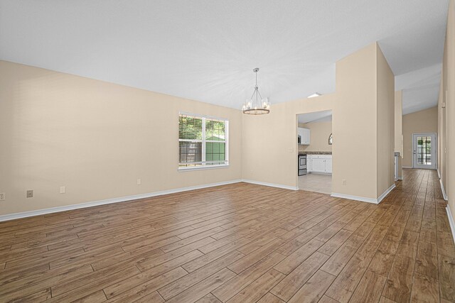 749 Randall Roberts Rd, Fort Walton Beach, FL 32547 - empty room with light wood-type flooring, a chandelier, and baseboards