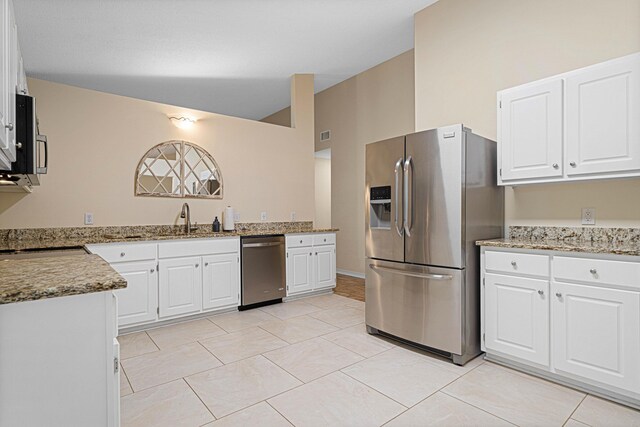 749 Randall Roberts Rd, Fort Walton Beach, FL 32547 - kitchen featuring appliances with stainless steel finishes, light stone counters, a sink, and white cabinetry