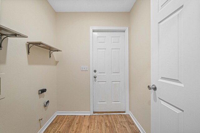 749 Randall Roberts Rd, Fort Walton Beach, FL 32547 - clothes washing area featuring light wood-type flooring and baseboards