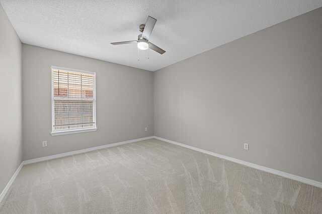 749 Randall Roberts Rd, Fort Walton Beach, FL 32547 - spare room with a ceiling fan, light carpet, baseboards, and a textured ceiling
