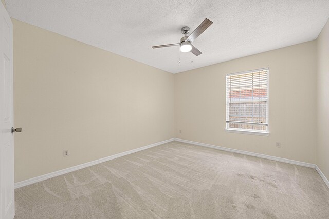 749 Randall Roberts Rd, Fort Walton Beach, FL 32547 - unfurnished room with a ceiling fan, light carpet, a textured ceiling, and baseboards