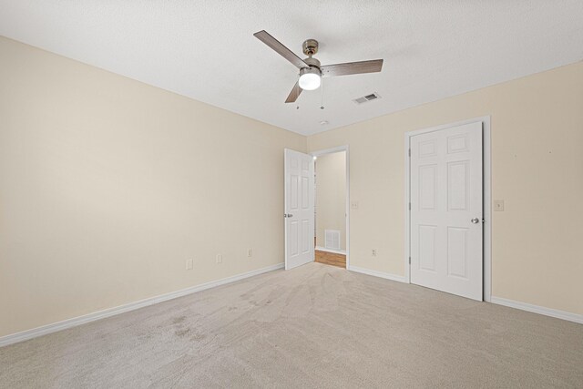 749 Randall Roberts Rd, Fort Walton Beach, FL 32547 - unfurnished bedroom with light colored carpet, baseboards, and a ceiling fan