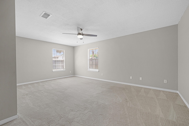 749 Randall Roberts Rd, Fort Walton Beach, FL 32547 - spare room with a ceiling fan, light colored carpet, baseboards, and a textured ceiling