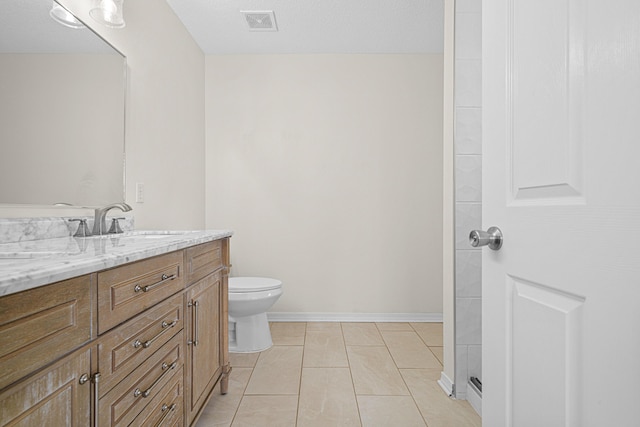 749 Randall Roberts Rd, Fort Walton Beach, FL 32547 - bathroom featuring vanity, toilet, tile patterned flooring, and baseboards