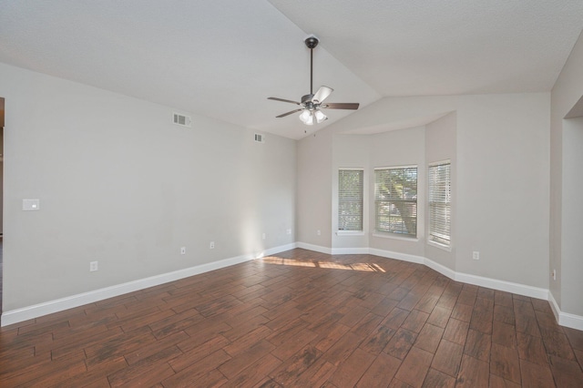 1501 N Partin Dr Unit 264, Niceville, FL 32578 - empty room featuring a ceiling fan, dark wood-type flooring, vaulted ceiling, and baseboards