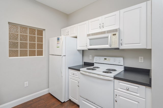 1501 N Partin Dr Unit 264, Niceville, FL 32578 - kitchen with white appliances, dark countertops, dark wood finished floors, and white cabinets