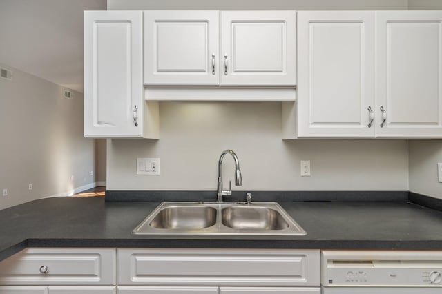 1501 N Partin Dr Unit 264, Niceville, FL 32578 - kitchen with a sink, dishwasher, dark countertops, and white cabinets