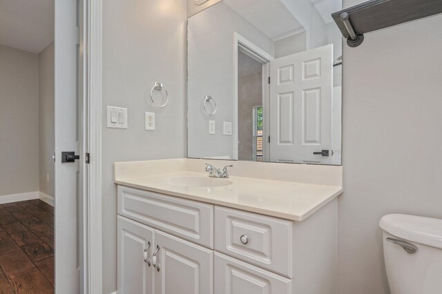 1501 N Partin Dr Unit 264, Niceville, FL 32578 - half bathroom with toilet, vanity, and wood finished floors
