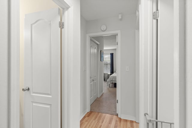 407 Apple Dr, Crestview, FL 32536 - hall featuring light wood-type flooring and baseboards