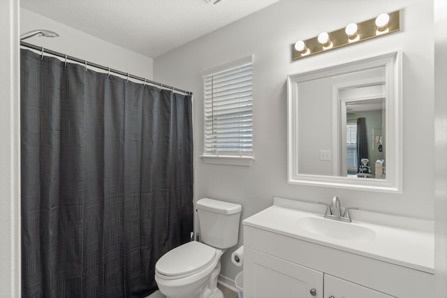 407 Apple Dr, Crestview, FL 32536 - full bathroom featuring toilet, vanity, a textured ceiling, and curtained shower
