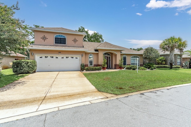 1961 Chesapeake Rdg, Fort Walton Beach, FL 32547 - view of front of home featuring stucco siding, driveway, a front yard, and an attached garage