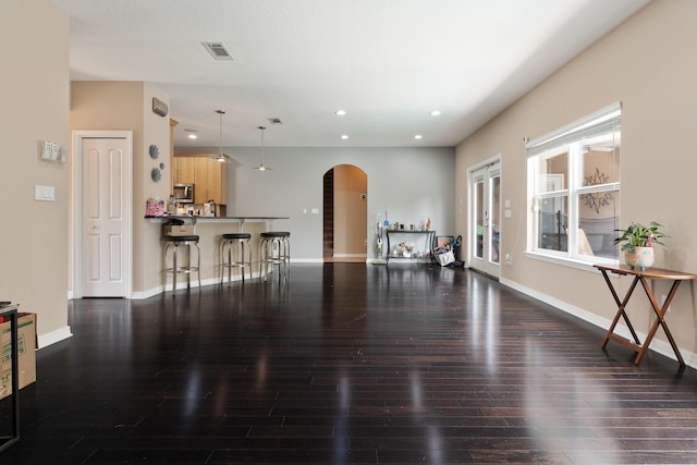1961 Chesapeake Rdg, Fort Walton Beach, FL 32547 - living area with arched walkways, wood finished floors, and recessed lighting