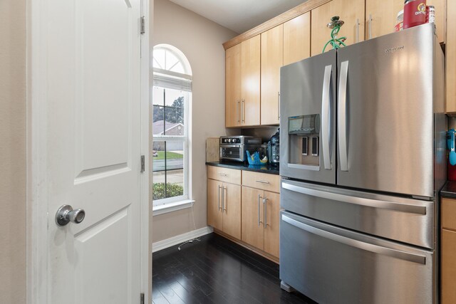 1961 Chesapeake Rdg, Fort Walton Beach, FL 32547 - kitchen featuring stainless steel fridge, light brown cabinets, dark countertops, and plenty of natural light
