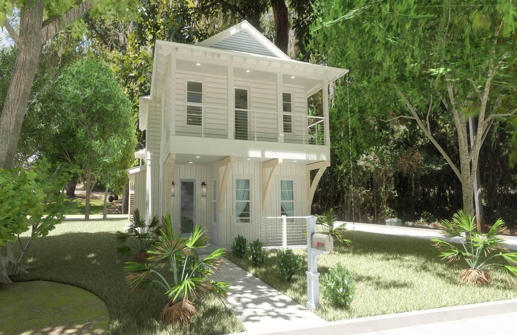 LOT1 E Mitchell Ave, Point Washington, FL 32459 - view of front of house featuring board and batten siding, a balcony, and a porch