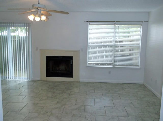 302 Olympia Ct, Fort Walton Beach, FL 32547 - unfurnished living room with ceiling fan, a fireplace, and baseboards