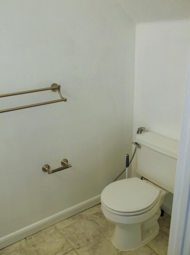 302 Olympia Ct, Fort Walton Beach, FL 32547 - bathroom with toilet and baseboards