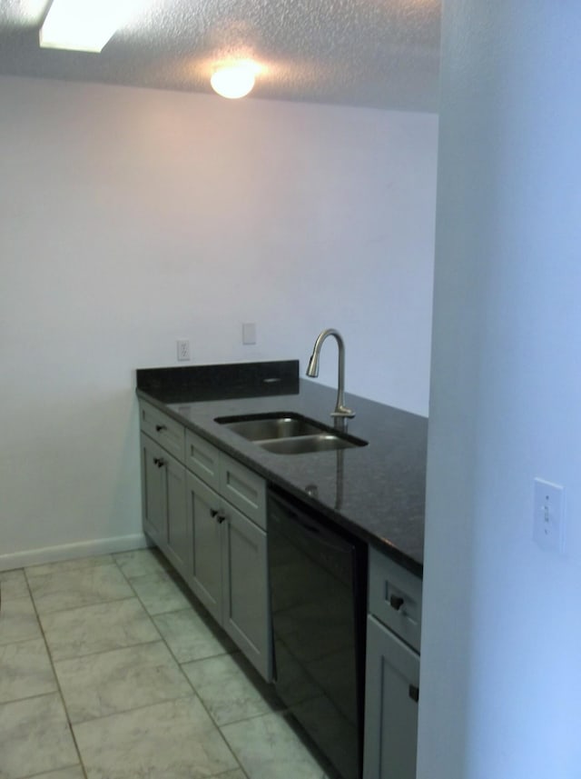 302 Olympia Ct, Fort Walton Beach, FL 32547 - kitchen with dishwasher, a sink, dark countertops, a textured ceiling, and light marble finish flooring
