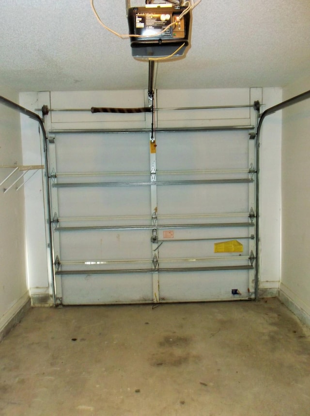 302 Olympia Ct, Fort Walton Beach, FL 32547 - garage with a garage door opener and baseboards