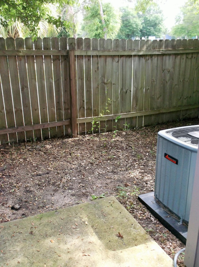 302 Olympia Ct, Fort Walton Beach, FL 32547 - view of yard featuring central AC unit and fence