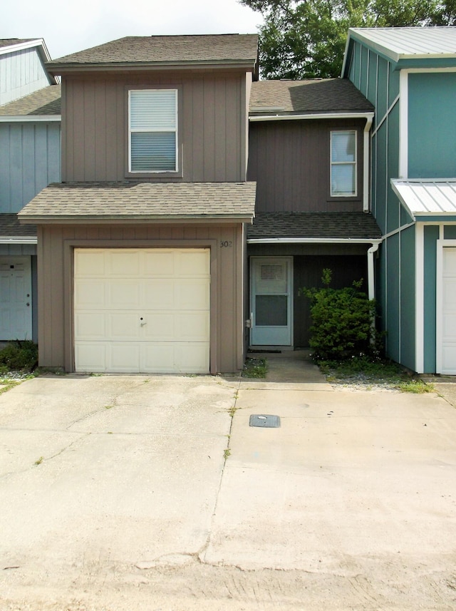 302 Olympia Ct, Fort Walton Beach, FL 32547 - multi unit property with an attached garage, roof with shingles, and concrete driveway
