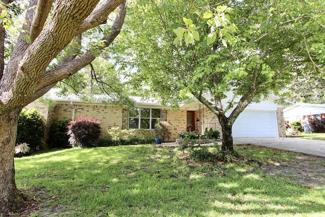 35 Birch Ave, Shalimar, FL 32579 - view of front facade featuring brick siding, driveway, a front yard, and an attached garage